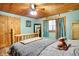 Charming bedroom featuring a log bed, light blue walls, and wooden ceiling at 2389 Bill Smith Rd, Martinsville, IN 46151