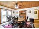 Traditional dining room featuring wooden floors, ceiling, table and chairs with an adjacent outdoor deck area at 2389 Bill Smith Rd, Martinsville, IN 46151