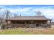 Charming single-story home with a welcoming front porch and decorative wagon wheels at 2389 Bill Smith Rd, Martinsville, IN 46151