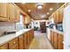 Traditional kitchen with wood cabinets, countertops, white appliances and an adjoining dining room at 2389 Bill Smith Rd, Martinsville, IN 46151