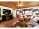 Living room featuring a fireplace, wood ceiling, and comfortable seating at 2389 Bill Smith Rd, Martinsville, IN 46151