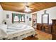 Bright primary bedroom featuring hardwood floors, large dresser, and a mirror at 2389 Bill Smith Rd, Martinsville, IN 46151