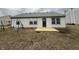 The backyard offers a new deck and mature trees at 2418 Shorewood Dr, Lebanon, IN 46052