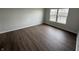 Bedroom showcasing hardwood floors and large windows with water views at 2418 Shorewood Dr, Lebanon, IN 46052
