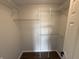 This empty closet features shelving and hardwood floors at 2418 Shorewood Dr, Lebanon, IN 46052