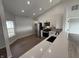 Well-lit kitchen featuring modern appliances, granite countertops, and backsplash at 2418 Shorewood Dr, Lebanon, IN 46052