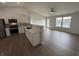 Modern kitchen opens to a naturally lit living area with water views at 2418 Shorewood Dr, Lebanon, IN 46052