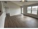 This living room features hardwood floors and views of the lake at 2418 Shorewood Dr, Lebanon, IN 46052