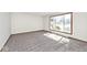 Sunlit bedroom with large window and plush carpeting, offering a comfortable retreat at 244 Corottoman Ct, Avon, IN 46123