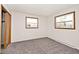 This bedroom features neutral carpet, two windows and a closet with wooden doors at 244 Corottoman Ct, Avon, IN 46123