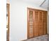 Hallway closet with wood-toned bi-fold doors at 244 Corottoman Ct, Avon, IN 46123