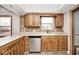 Open concept kitchen with granite countertops, and ample cabinet space for storage at 244 Corottoman Ct, Avon, IN 46123