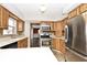 Bright kitchen features stainless steel appliances and light wood cabinetry at 244 Corottoman Ct, Avon, IN 46123