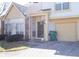 Two-story home featuring an attached garage, tidy lawn, and welcoming covered front entryway at 2449 Chaseway Ne Ct # Blk B, Indianapolis, IN 46268