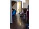 Open foyer showcasing stairs to the second floor with hardwood floors and blue upholstered furniture at 2449 Chaseway Ne Ct # Blk B, Indianapolis, IN 46268