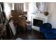 A living room area with a fireplace and cardboard boxes at 2449 Chaseway Ne Ct # Blk B, Indianapolis, IN 46268