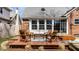 Deck with outdoor seating overlooking the lush backyard, perfect for relaxation and entertaining at 2615 Kessler Blvd E Dr, Indianapolis, IN 46220