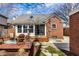 Cozy backyard with a wooden deck and comfortable Adirondack chairs, perfect for outdoor relaxation and entertaining at 2615 Kessler Blvd E Dr, Indianapolis, IN 46220