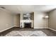 Finished basement with a fireplace, modern art, and a decorative area rug at 2615 Kessler Blvd E Dr, Indianapolis, IN 46220