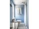 Clean bathroom with new fixtures, a toilet, and a shower with a white curtain at 2615 Kessler Blvd E Dr, Indianapolis, IN 46220