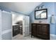 Charming bathroom with a vanity, a mirror, and a closet with lots of storage at 2615 Kessler Blvd E Dr, Indianapolis, IN 46220