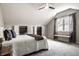 Bright bedroom with an overhead fan, large closets, and a window bench seat at 2615 Kessler Blvd E Dr, Indianapolis, IN 46220