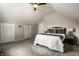 Bright bedroom with an overhead fan, neutral tones, and comfortable carpet at 2615 Kessler Blvd E Dr, Indianapolis, IN 46220