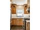 Close-up of kitchen sink and countertops featuring white subway tile and stainless steel appliances at 2615 Kessler Blvd E Dr, Indianapolis, IN 46220