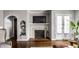 Bright living room featuring a fireplace, stylish decor, and classic architectural details at 2615 Kessler Blvd E Dr, Indianapolis, IN 46220