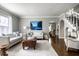 Open-concept living area featuring hardwood floors, modern decor, and plenty of space at 2615 Kessler Blvd E Dr, Indianapolis, IN 46220