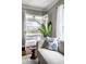 Living room with a view to the porch and swing. Window light, patterned pillows at 2615 Kessler Blvd E Dr, Indianapolis, IN 46220