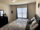 Comfortable bedroom with plush carpeting, natural light, and neutral tones for a restful atmosphere at 2625 Kilgobbin Cres, Brownsburg, IN 46112