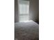 Bright bedroom featuring a white mattress and window with adjustable blinds at 2625 Kilgobbin Cres, Brownsburg, IN 46112