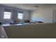 Spacious bonus room with neutral walls, two windows, and carpeted floors ready for your personal touch at 2625 Kilgobbin Cres, Brownsburg, IN 46112