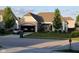 Charming single-story home with brick accents, attached garage, and well-manicured lawn and landscape at 2625 Kilgobbin Cres, Brownsburg, IN 46112