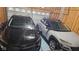 Spacious two car garage with parked black and silver vehicles at 2625 Kilgobbin Cres, Brownsburg, IN 46112