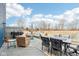 Inviting back deck with grill, comfortable seating, and a view of the lush backyard with pond at 3132 W Meadowbend Dr, Monrovia, IN 46157