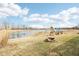 Scenic backyard with pond, playground, and firepit, offering a perfect outdoor Gathering retreat at 3132 W Meadowbend Dr, Monrovia, IN 46157