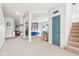 Spacious basement featuring neutral carpet, open layout, white support columns, and stairs to the upper level at 3132 W Meadowbend Dr, Monrovia, IN 46157