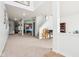 Spacious basement featuring neutral carpet, open layout, white support columns, and stairs to the upper level at 3132 W Meadowbend Dr, Monrovia, IN 46157