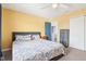 Bright bedroom showcasing a cozy bed and access to an adjoining room or closet, offering versatility at 3132 W Meadowbend Dr, Monrovia, IN 46157