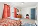 Bright bedroom with vibrant curtains, a comfortable bed, and playful accents, perfect for relaxation at 3132 W Meadowbend Dr, Monrovia, IN 46157