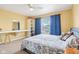 Bright bedroom featuring a comfortable bed, desk area, and ample natural light for a serene retreat at 3132 W Meadowbend Dr, Monrovia, IN 46157
