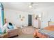 Playful bedroom featuring a decorative rug, pink dresser, and colorful wall art at 3132 W Meadowbend Dr, Monrovia, IN 46157