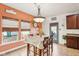 Inviting dining area with a table and chairs near windows and exterior access, complete with a charming light fixture at 3132 W Meadowbend Dr, Monrovia, IN 46157