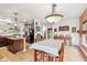 Open dining space with a view to the kitchen, featuring a table set for meals and a cozy atmosphere at 3132 W Meadowbend Dr, Monrovia, IN 46157
