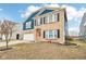 Inviting two-story home featuring brick and blue siding, a two-car garage, and a neatly landscaped front yard at 3132 W Meadowbend Dr, Monrovia, IN 46157