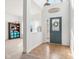 Bright and airy foyer with tile entry, carpeted living space, high ceilings, and a large window at 3132 W Meadowbend Dr, Monrovia, IN 46157