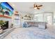 Cozy living room with a stone fireplace, large screen TV, and comfortable seating, perfect for relaxing or entertaining at 3132 W Meadowbend Dr, Monrovia, IN 46157