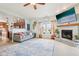 Spacious living room with a cozy fireplace, neutral color palette, and seamlessly connects to the dining area at 3132 W Meadowbend Dr, Monrovia, IN 46157